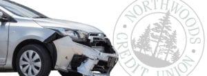 white car with damage and circle NCU logo